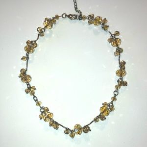 Lightly Tinted Gold Beaded Necklace with a small dangle.